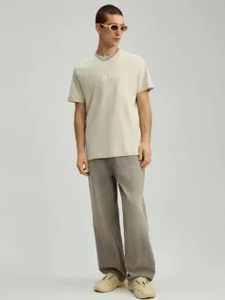 Beżowa koszulka z haftem loose fit