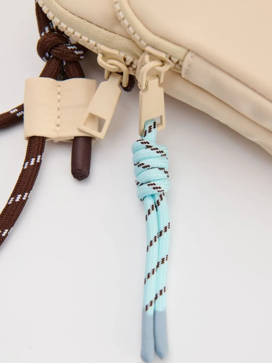 Beżowa torebka crossbody na sznurku