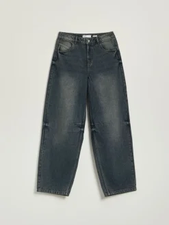 Ciemnogranatowe jeansy baggy fit z przetarciami