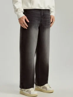 Czarne jeansy baggy fit z motywem tribal na tyle