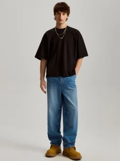 Granatowe jeansy baggy fit z efektem sprania