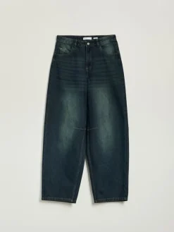 Granatowe jeansy baggy fit z przetarciami