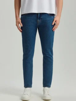 Granatowe jeansy carrot fit