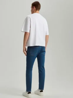 Granatowe jeansy carrot fit