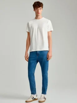 Granatowe jeansy carrot fit