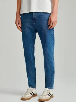 Granatowe jeansy carrot fit