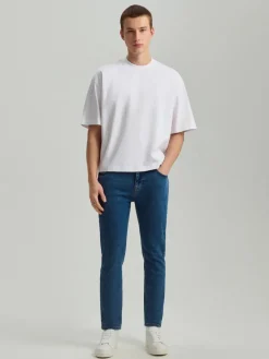 Granatowe jeansy carrot fit