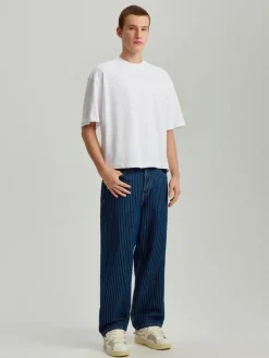 Granatowe jeansy skater fit w prążki