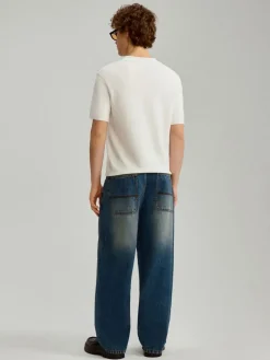 Granatowe jeansy skater fit z przetarciami
