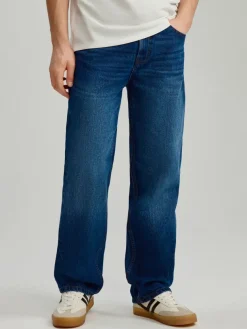 Granatowe jeansy straight fit z efektem sprania