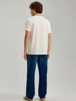 Granatowe jeansy straight fit z efektem sprania