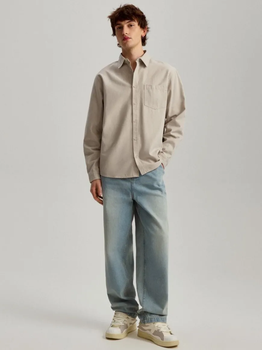 Jasnoniebieskie jeansy baggy fit z efektem sprania