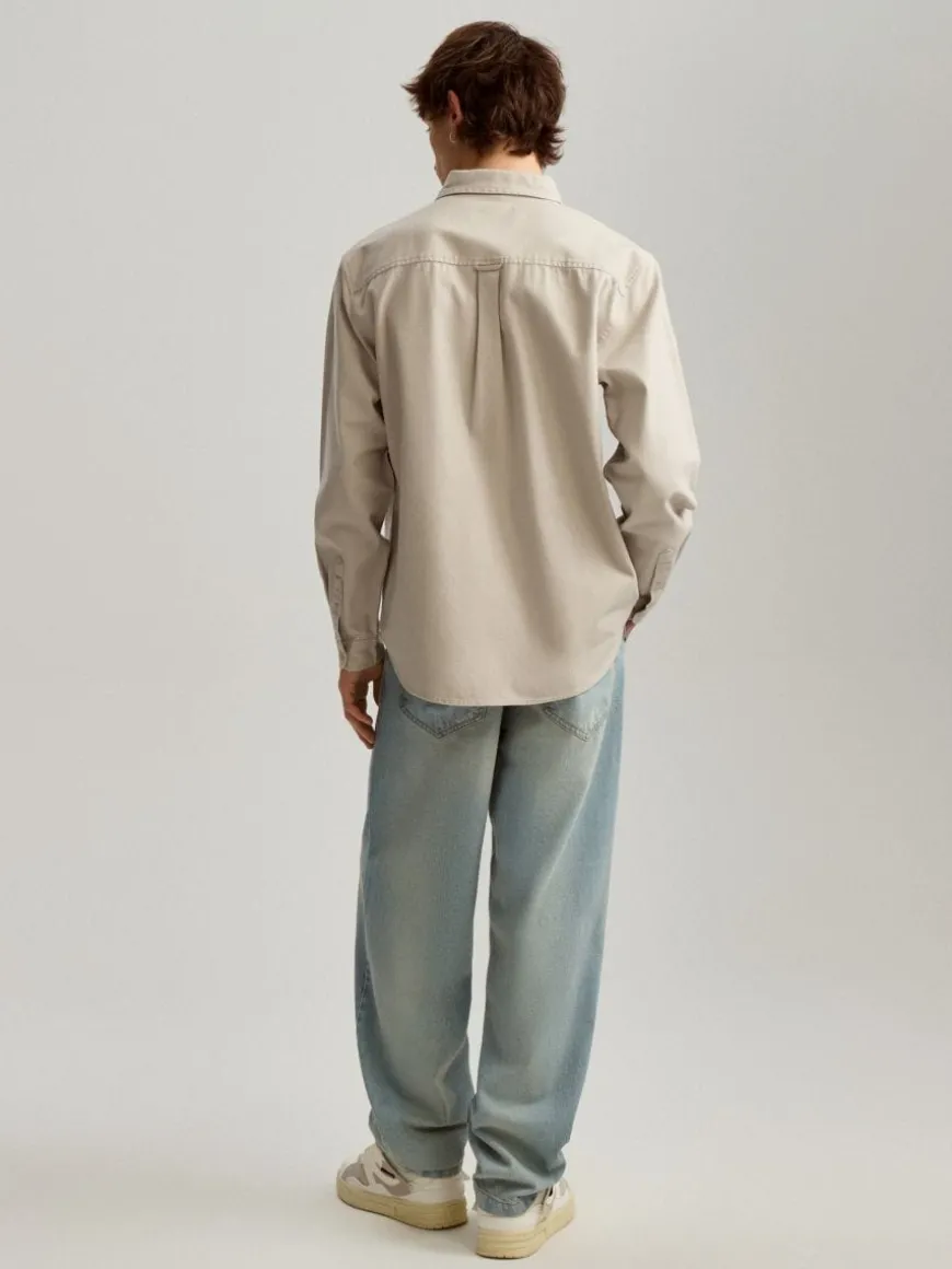 Jasnoniebieskie jeansy baggy fit z efektem sprania
