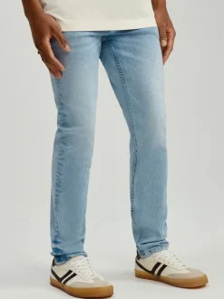 Jasnoniebieskie jeansy slim fit z efektem sprania