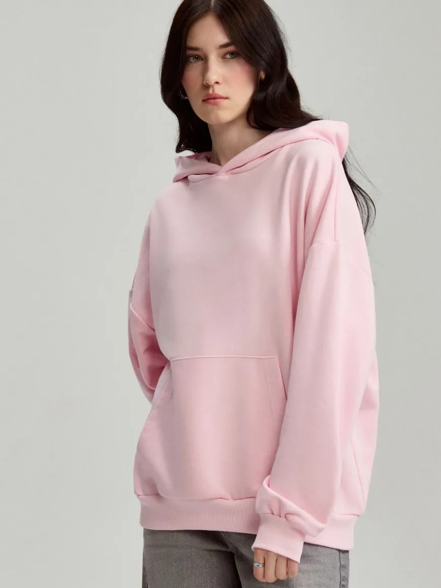 Jasnoróżowa gładka bluza loose fit z kapturem