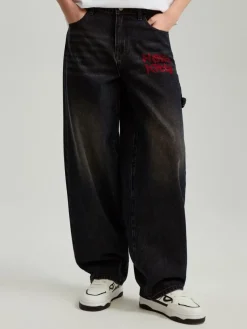 Jeansy baggy fit carpenter z motywem Hello Kitty z dżetów