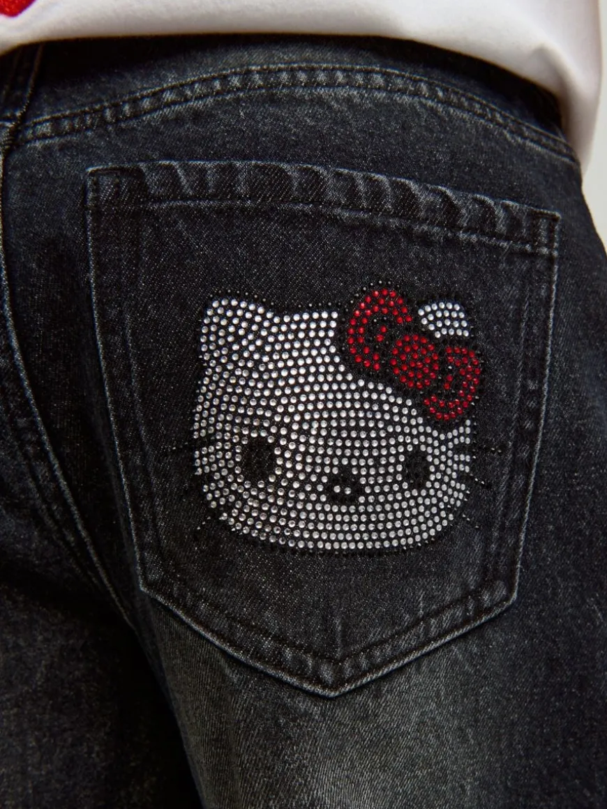 Jeansy baggy fit carpenter z motywem Hello Kitty z dżetów