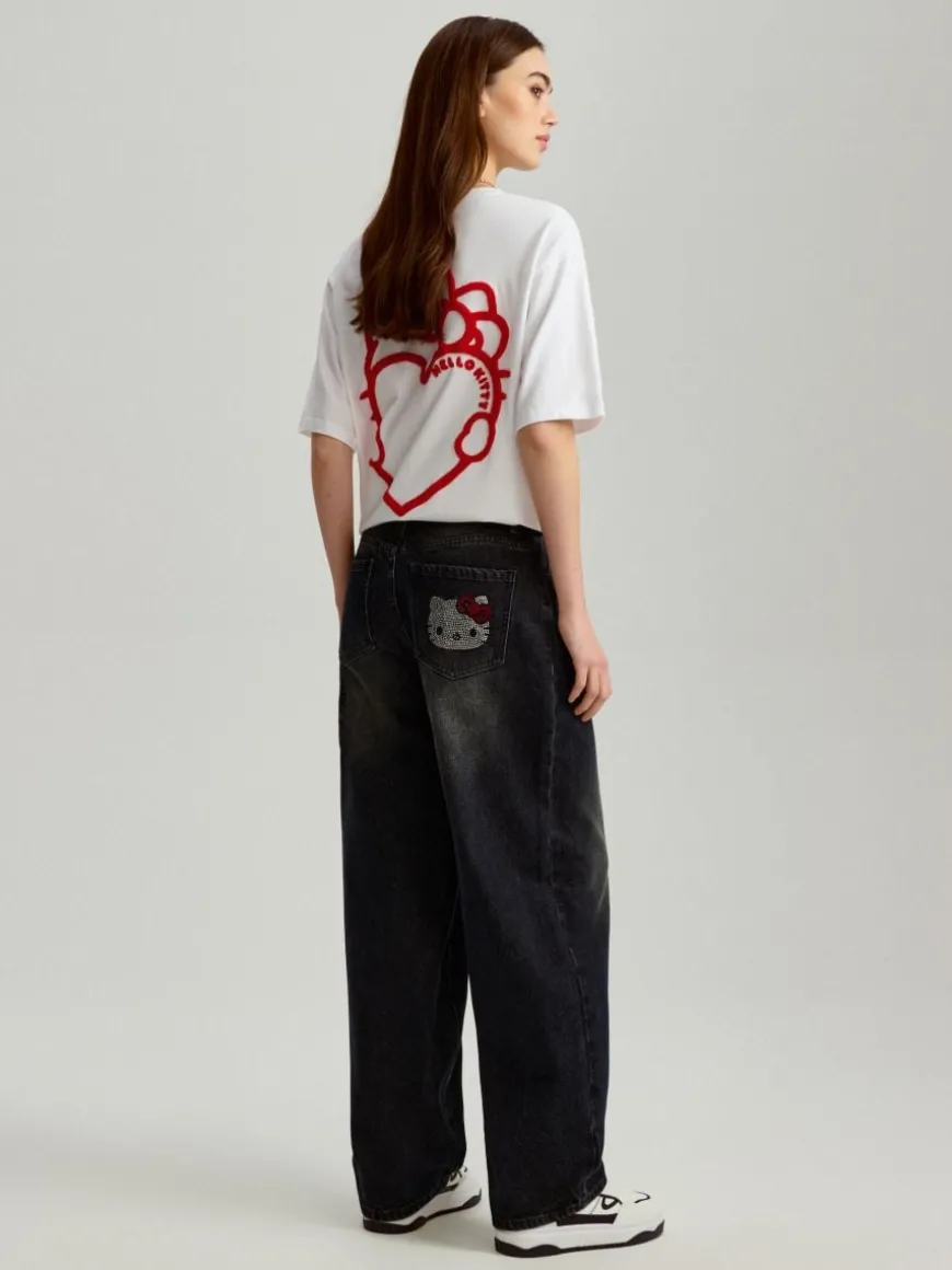 Jeansy baggy fit carpenter z motywem Hello Kitty z dżetów