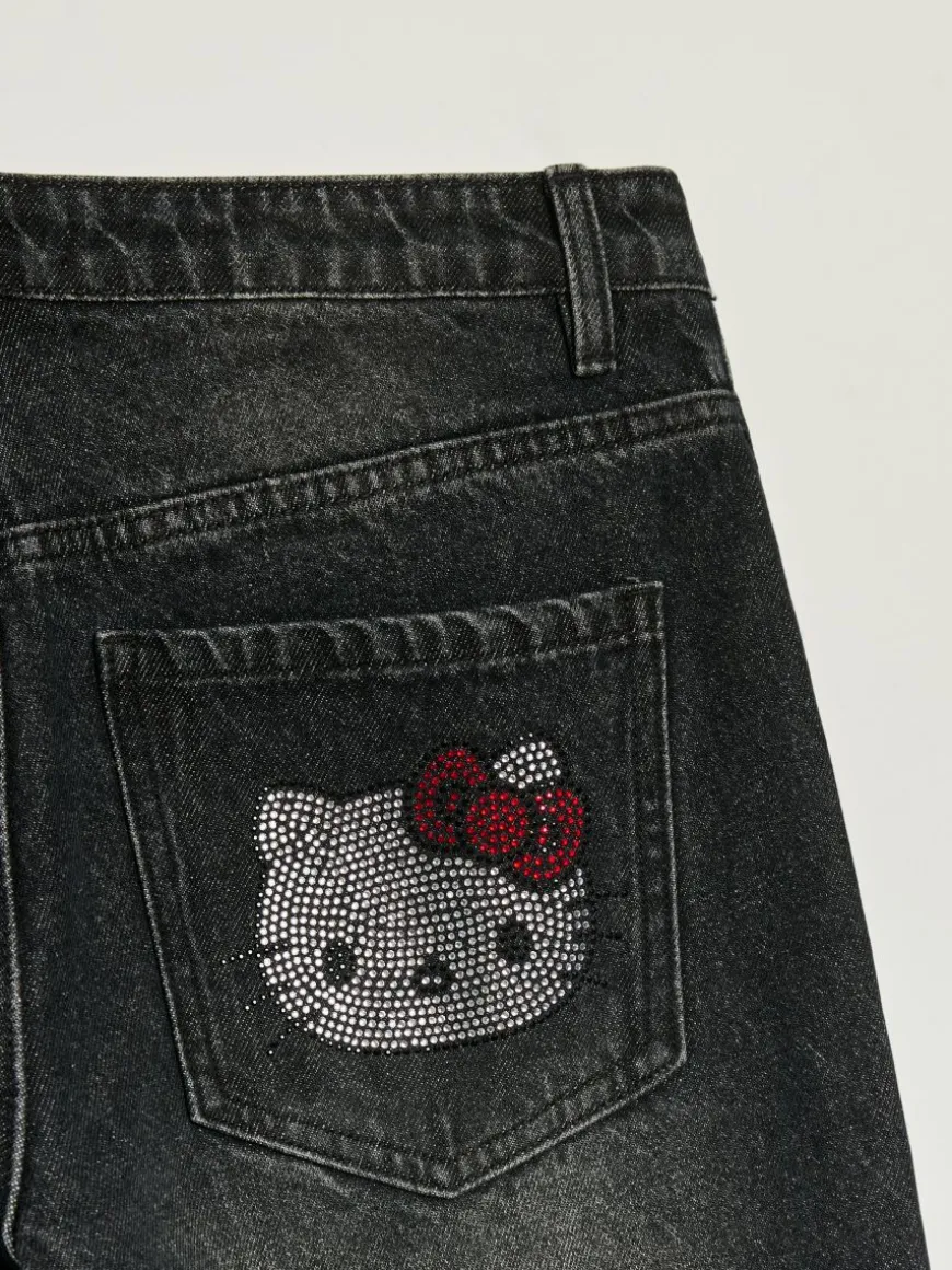 Jeansy baggy fit carpenter z motywem Hello Kitty z dżetów