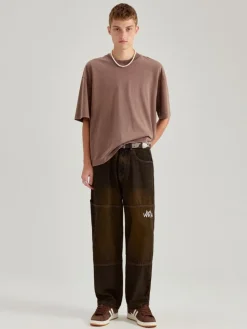 Jeansy baggy fit dirty wash z haftami