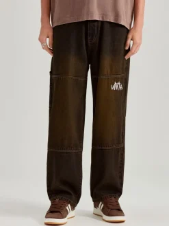 Jeansy baggy fit dirty wash z haftami