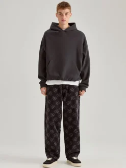 Jeansy baggy fit typu skater w print all over