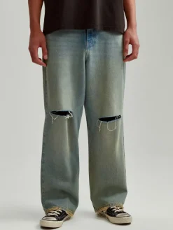 Jeansy wide leg z dziurami i efektem dirty wash niebieskie