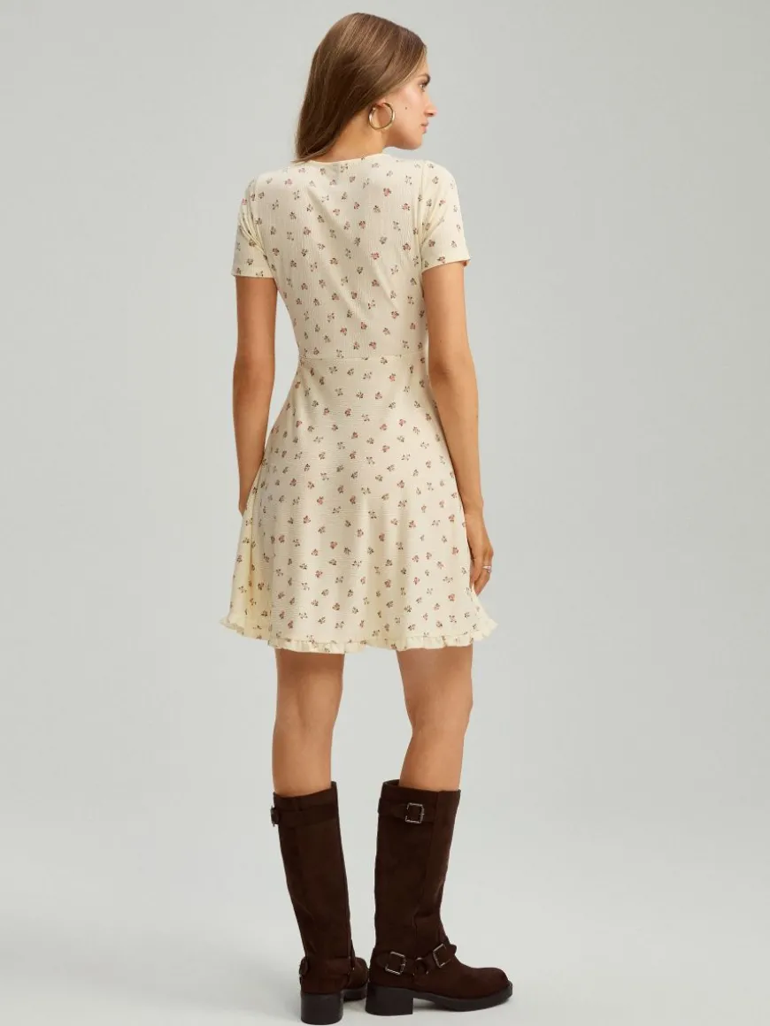 Kopertowa sukienka mini fit&flare w kwiaty żółta