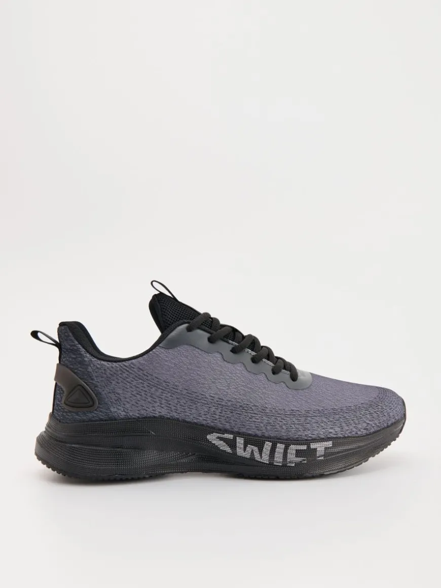 Lekkie sneakersy z nadrukiem na podeszwie szare