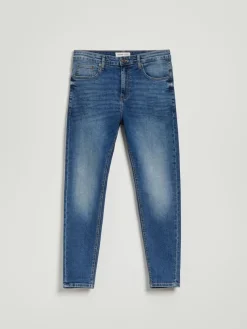 Niebieskie jeansy carrot fit z mocnym efektem sprania