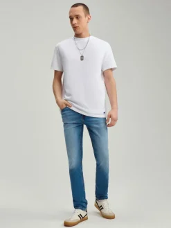 Niebieskie jeansy slim fit z efektem sprania