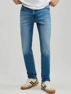 Niebieskie jeansy slim fit z efektem sprania
