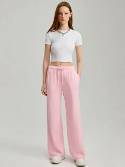 Różowe spodnie dresowe mid waist wide leg