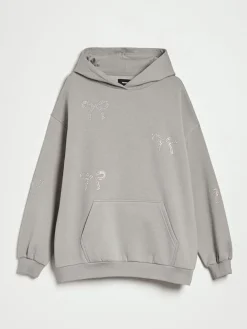Szara bluza loose fit z kapturem i motywem kokardek