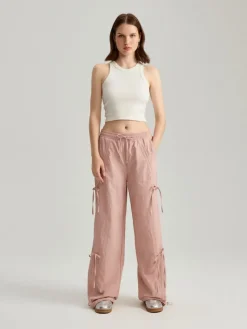 Tkaninowe spodnie straight fit z wiązaniami różowe